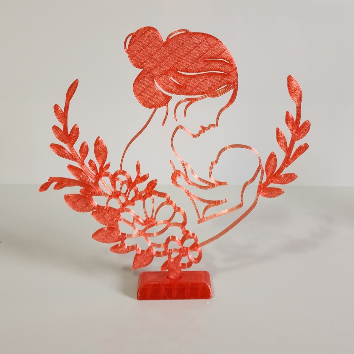 Mãe com Bebê Vermelho